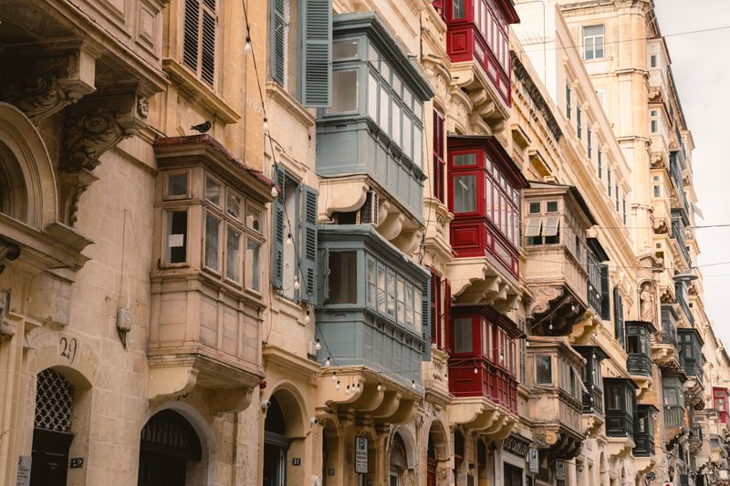 Traditional Maltese balconies on a residential street, where salt air and dust mean regular cleaning