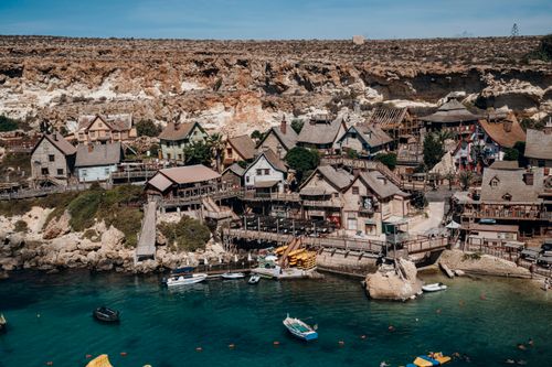 Free Charming aerial view of Popeye Village's unique architecture by the sea in Malta. Stock Photo