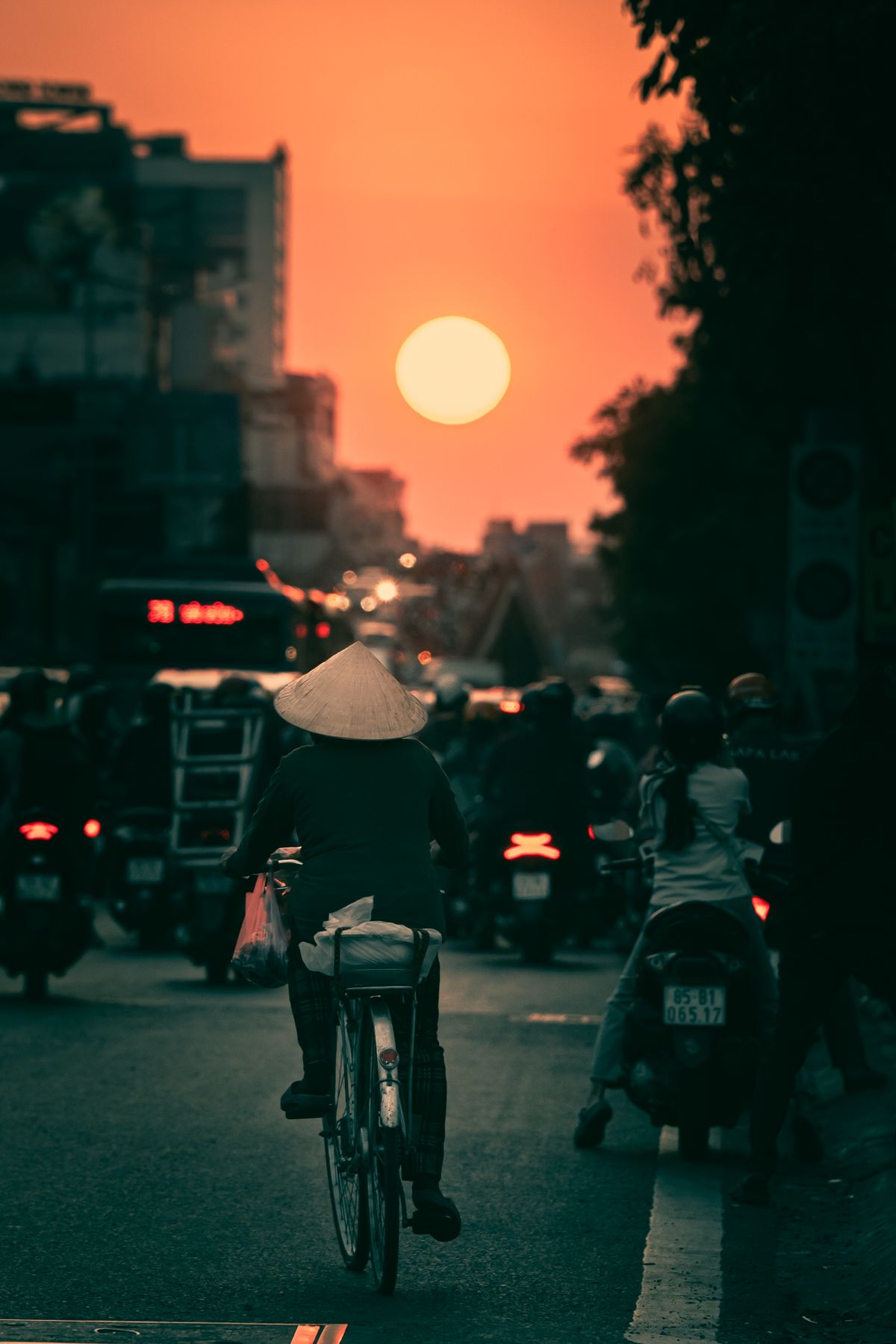 Urban bicycle commuter riding through traffic