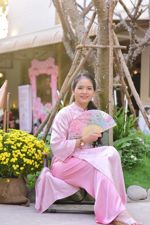 Woman in Traditional Pink Dress with Fan Outdoors · Free Stock Photo