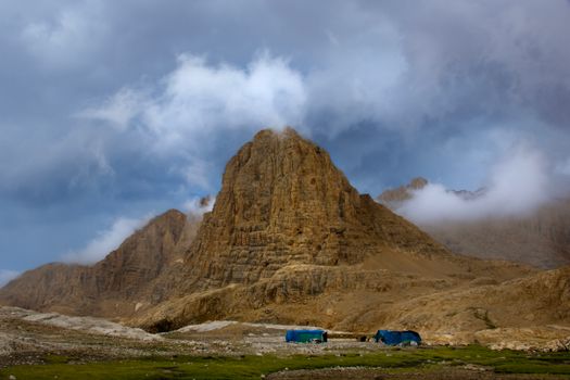 Breathtaking mountain view with a dramatic cloudy sky, showcasing nature's grandeur.