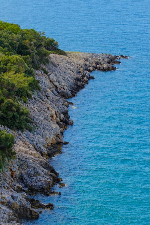Free Stunning view of a rocky coastline meeting the turquoise Aegean Sea in Aydın, Türkiye. Stock Photo