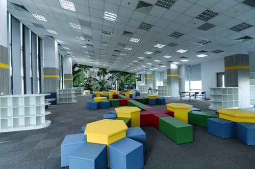 Free Spacious modern indoor learning space with colorful furniture and tropical theme decor. Stock Photo