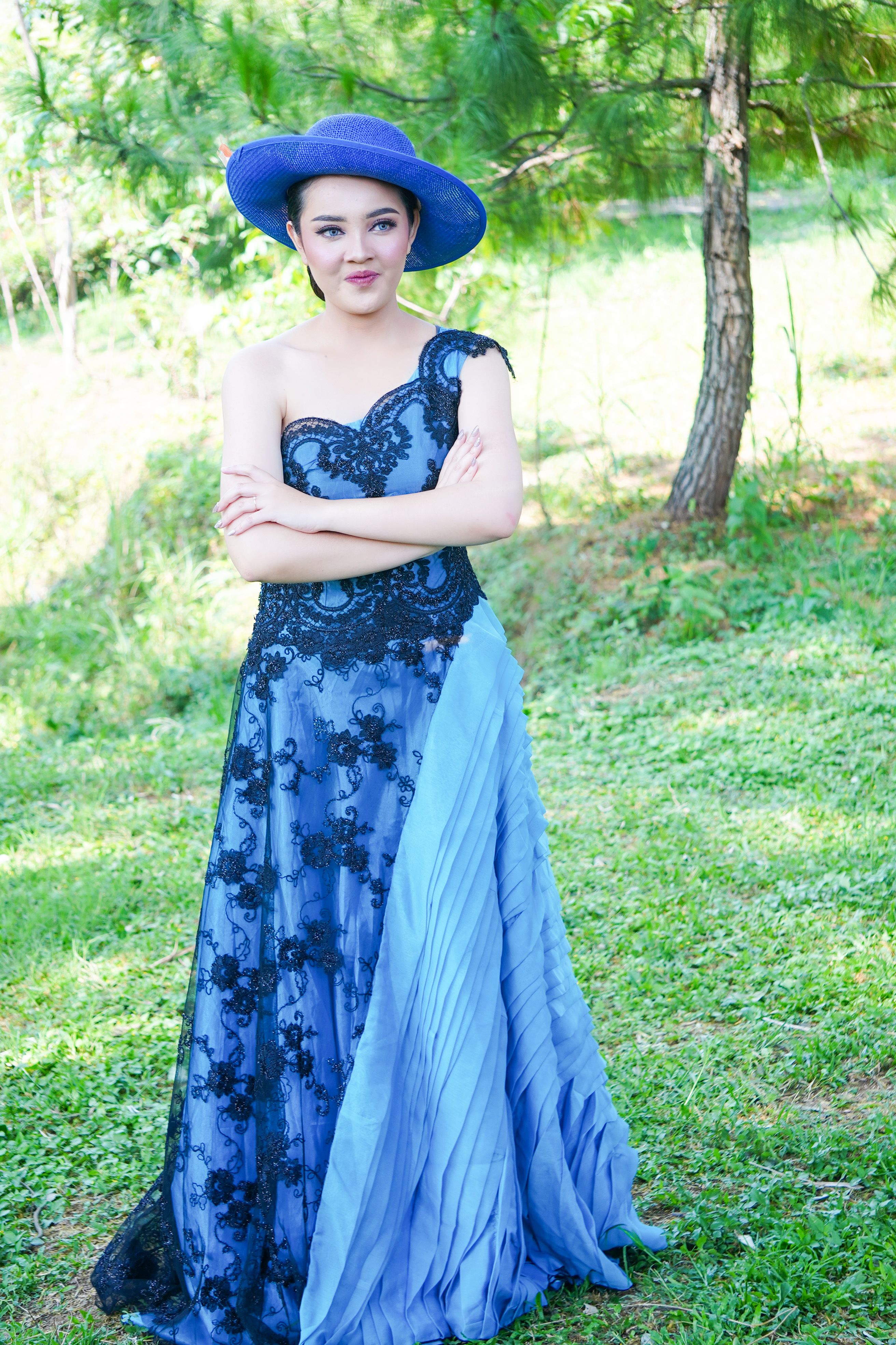 Elegant Woman in Blue Gown Outdoors · Free Stock Photo
