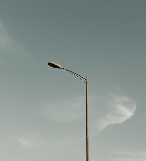 Free A tall streetlamp stands against a clear sky, showcasing minimalist urban design. Stock Photo
