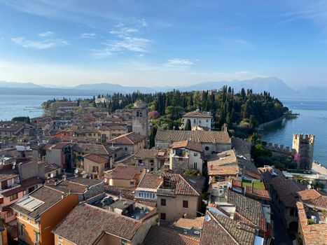Aerial view of the historic town Sirmione on Lake Garda with scenic landscapes and medieval architecture.