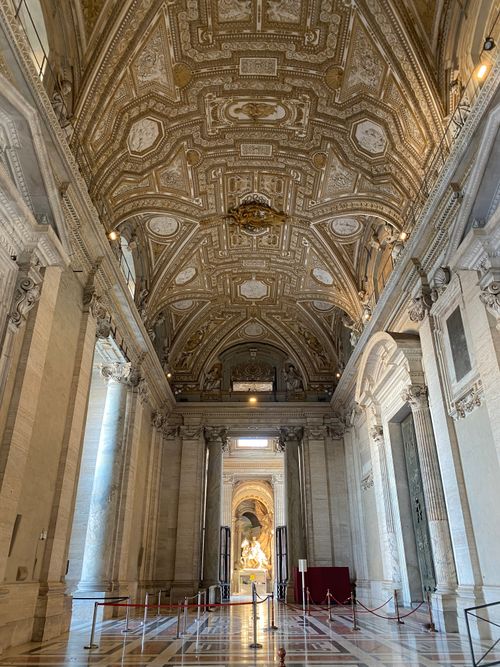 Free Stunning view of the ornately decorated ceiling of St. Peter's Basilica, an iconic Vatican landmark. Stock Photo