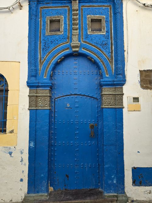 Free A stunning blue door showcasing traditional Tunisian architectural design with intricate details. Stock Photo