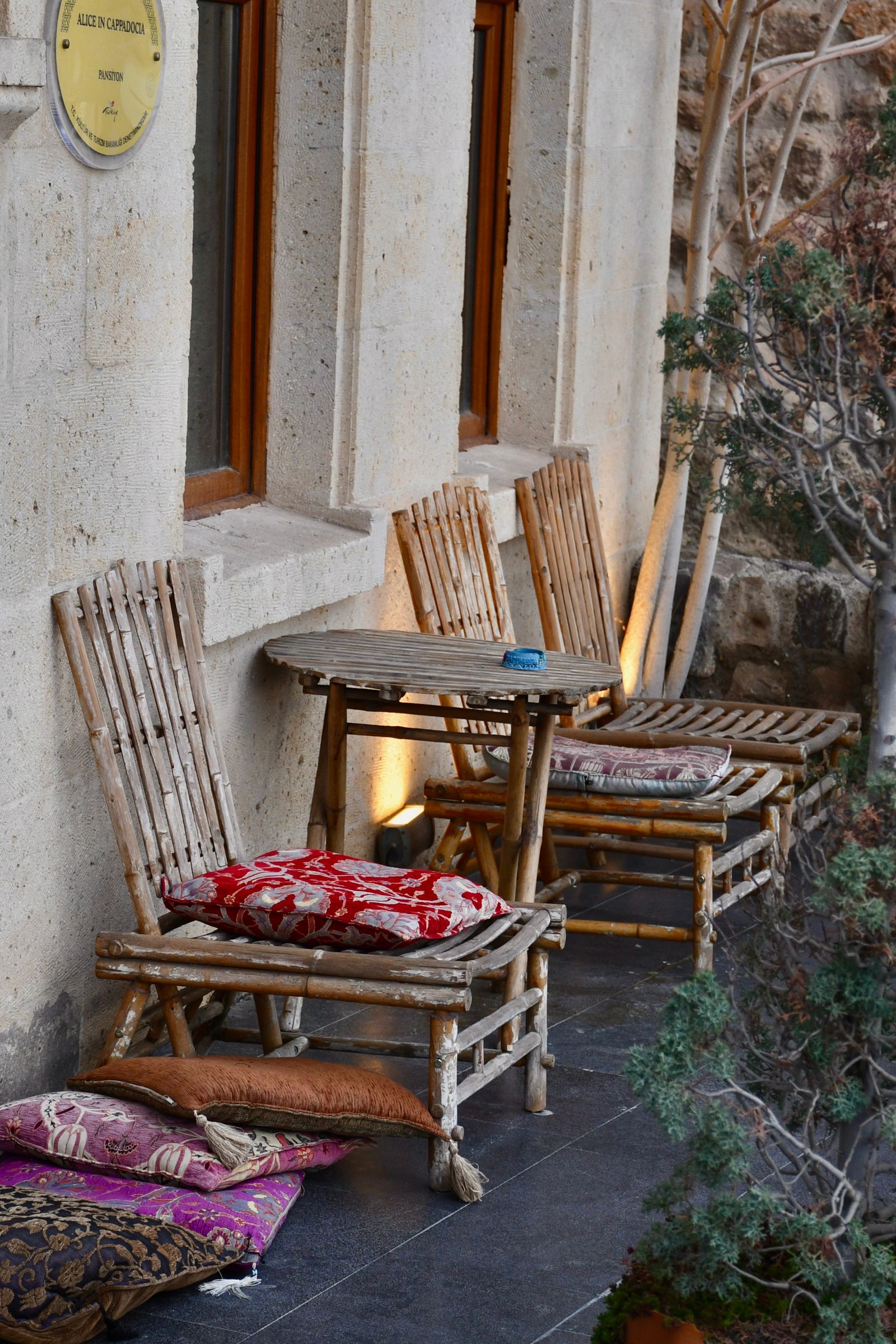Outdoor café-style chairs with loose cushions that need weatherproof storage