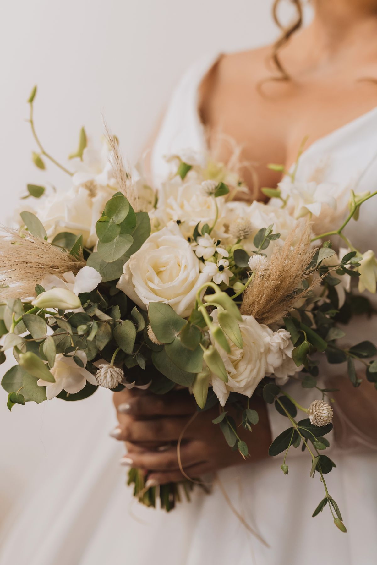 Elegant bridal bouquet of white flowers and greenery