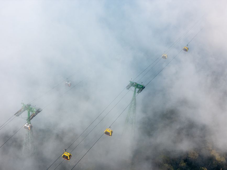 Langkawi SkyCab cable car ascending over lush rainforest in Langkawi, Malaysia