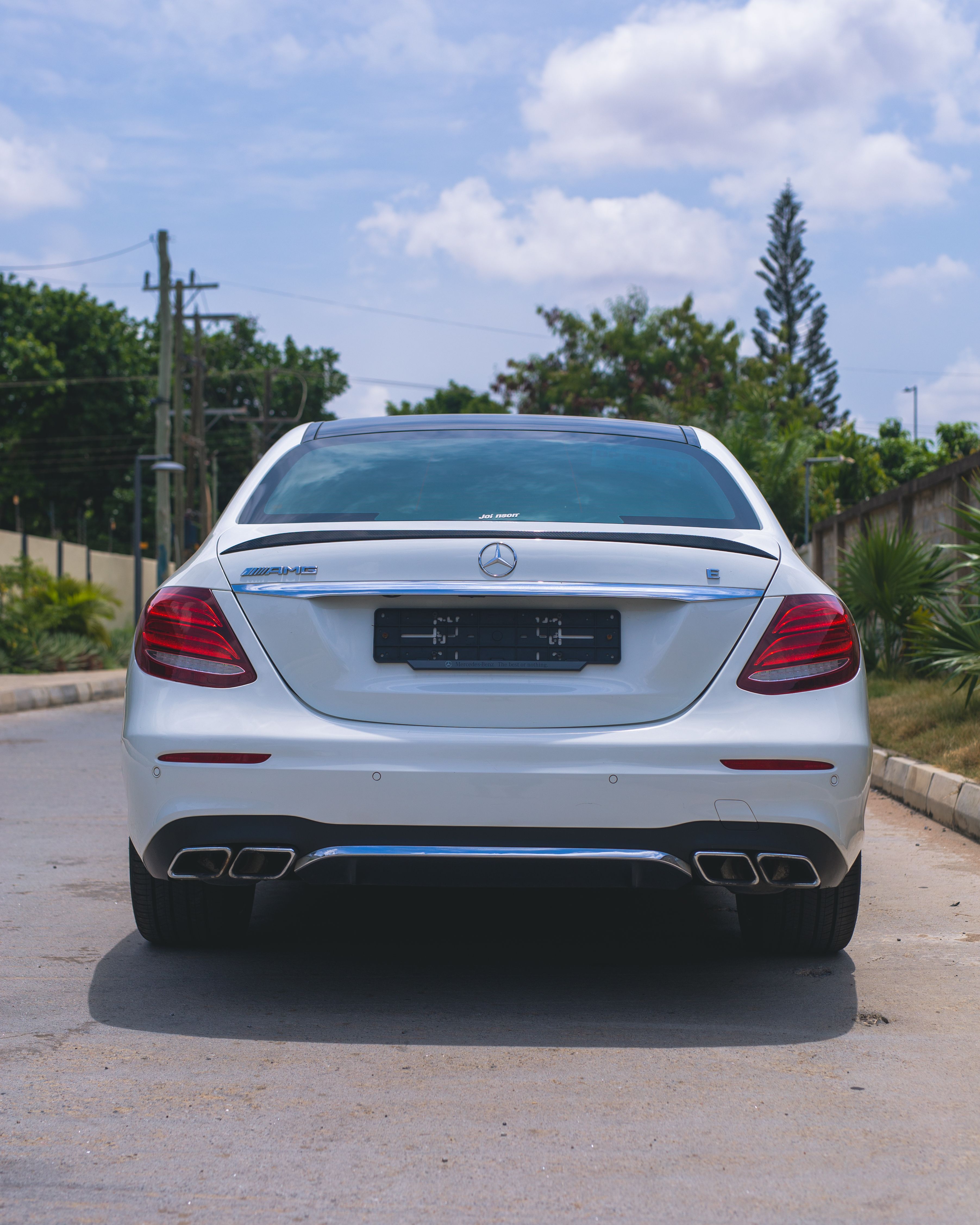 Rear View of Mercedes-Benz E-Class Sedan Outdoors · Free Stock Photo