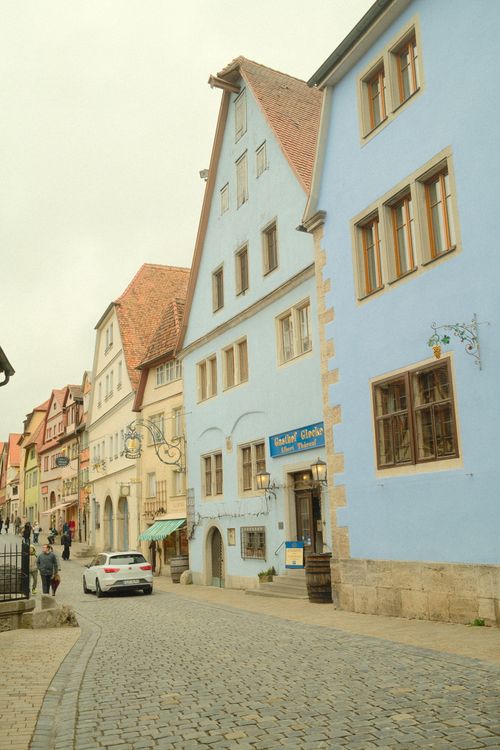 Free A picturesque street scene in Rothenburg ob der Tauber, showcasing colorful medieval buildings. Stock Photo