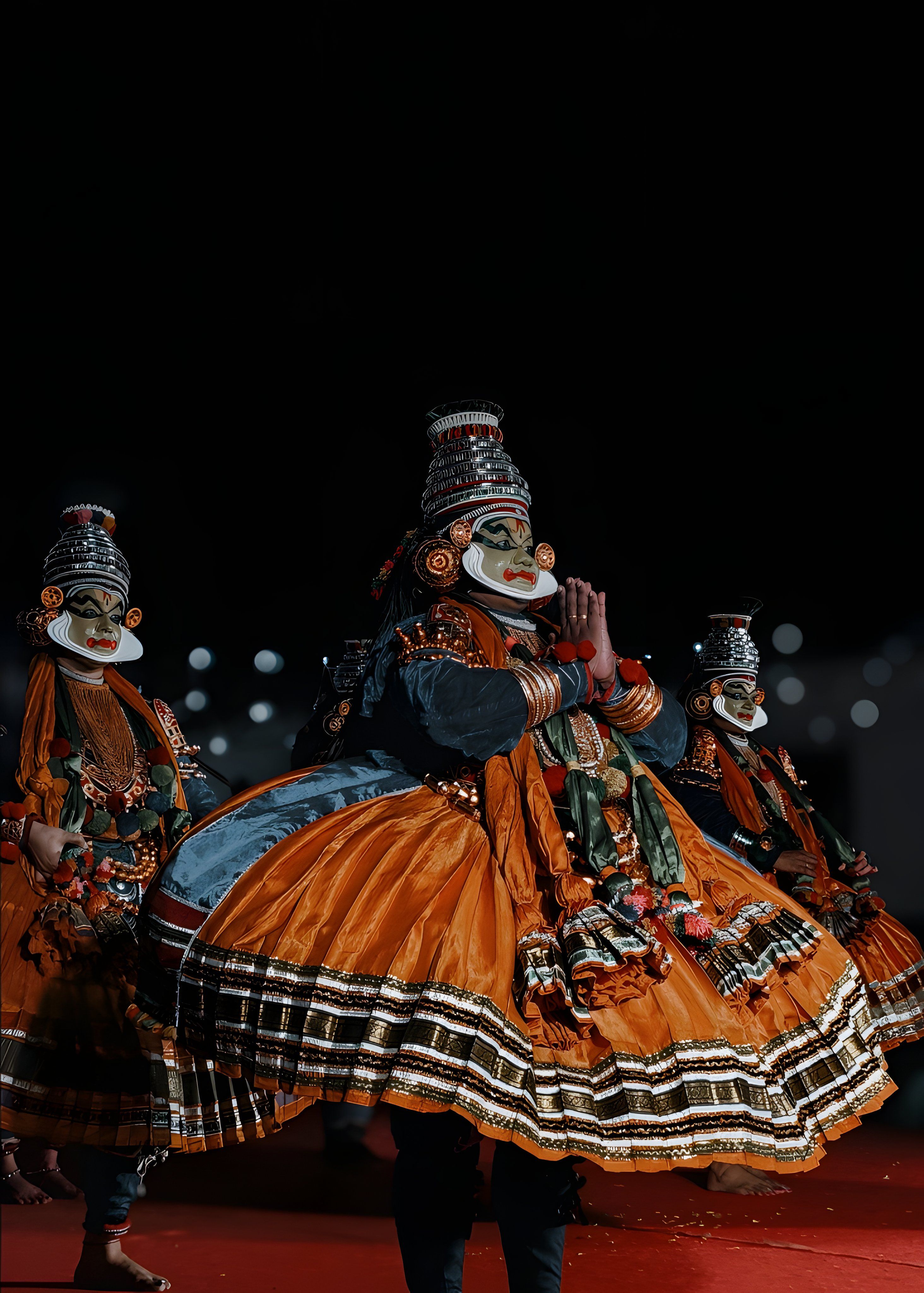 Vibrant Kathakali dancers in colorful costumes performing a traditional dance.