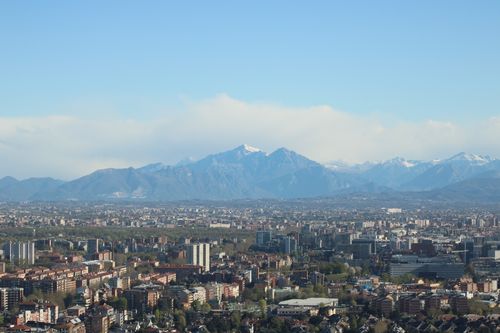 Free Stunning aerial view of Milano cityscape with the Alps in the background, showcasing urban and natural landscapes. Stock Photo