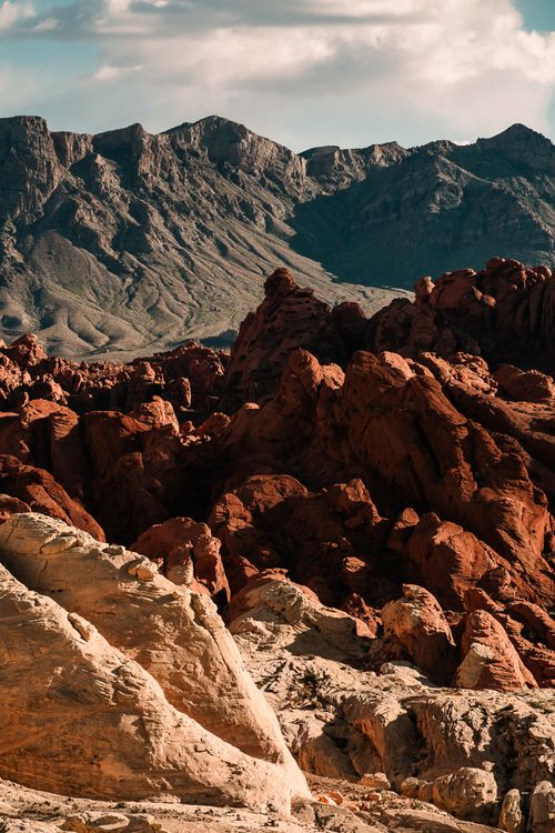 Free Stunning view of red rock formations with mountain backdrop in Moapa Valley, Nevada. Stock Photo