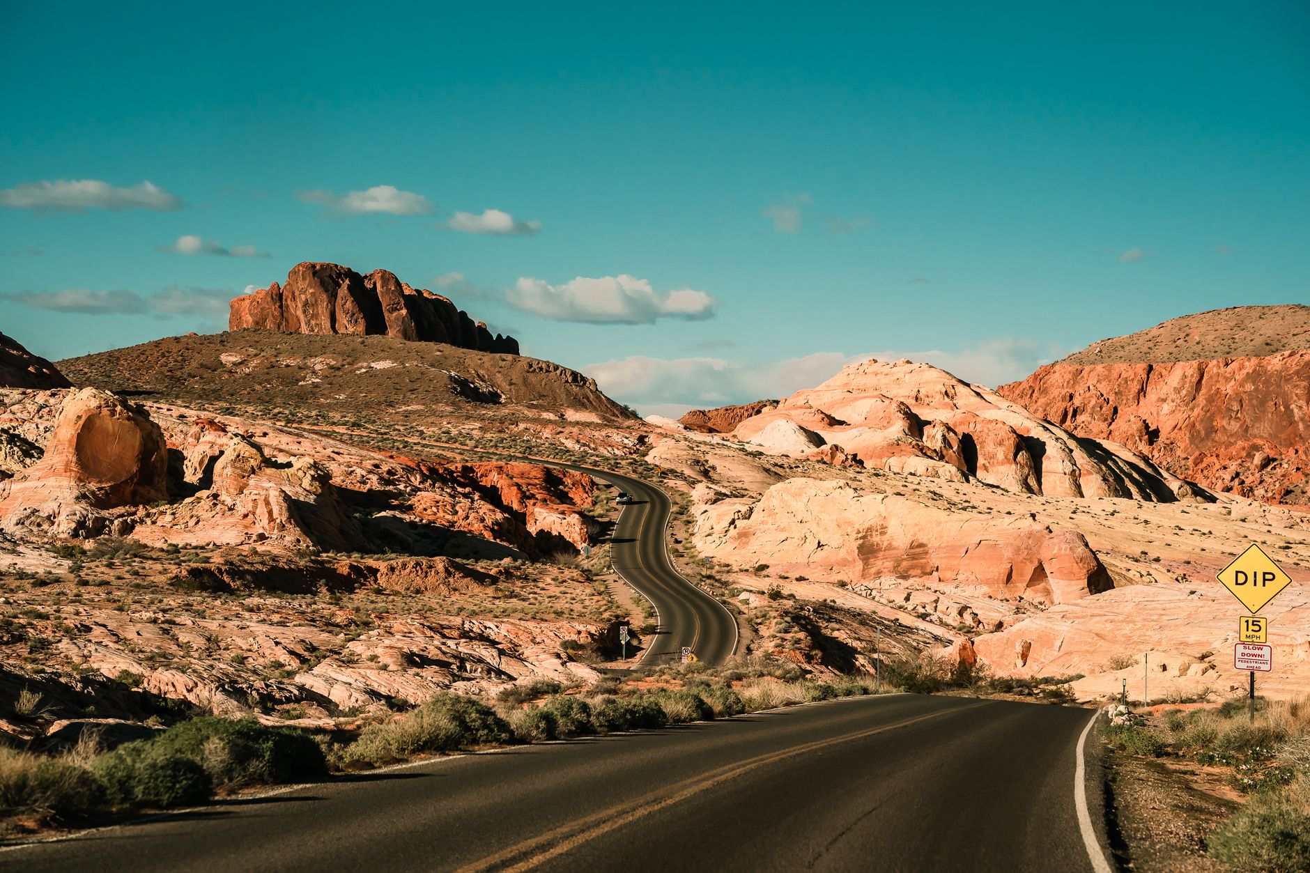 Red sandstone cliffs of Red Rock Canyon under blue sky
