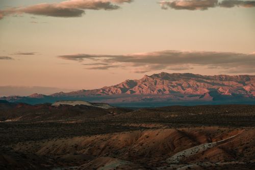 Free Breathtaking landscape of Moapa Valley, Nevada with mountains at sunset. Perfect for nature and travel enthusiasts. Stock Photo