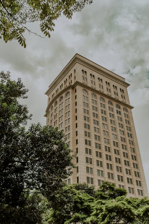 Photo Of Building Under Cloudy Sky