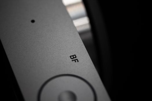 Macro shot of a camera dial with BF marking, featuring a sleek modern design.
