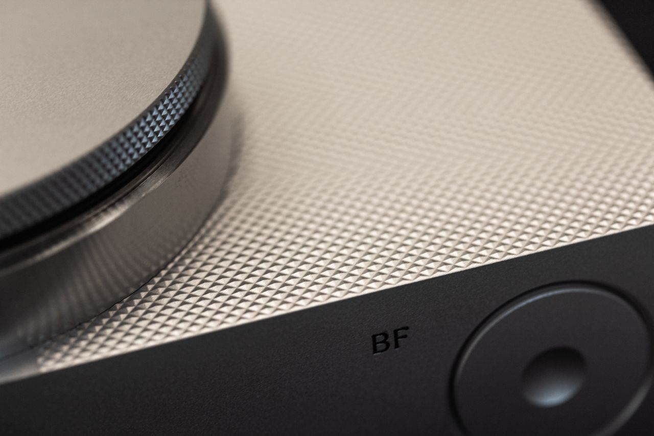 detailed macro shot of a modern knob on a textured surface emphasizing