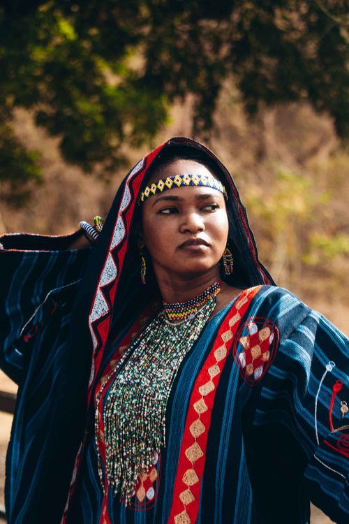 Free Elegant woman in traditional African dress in an outdoors setting. Stock Photo