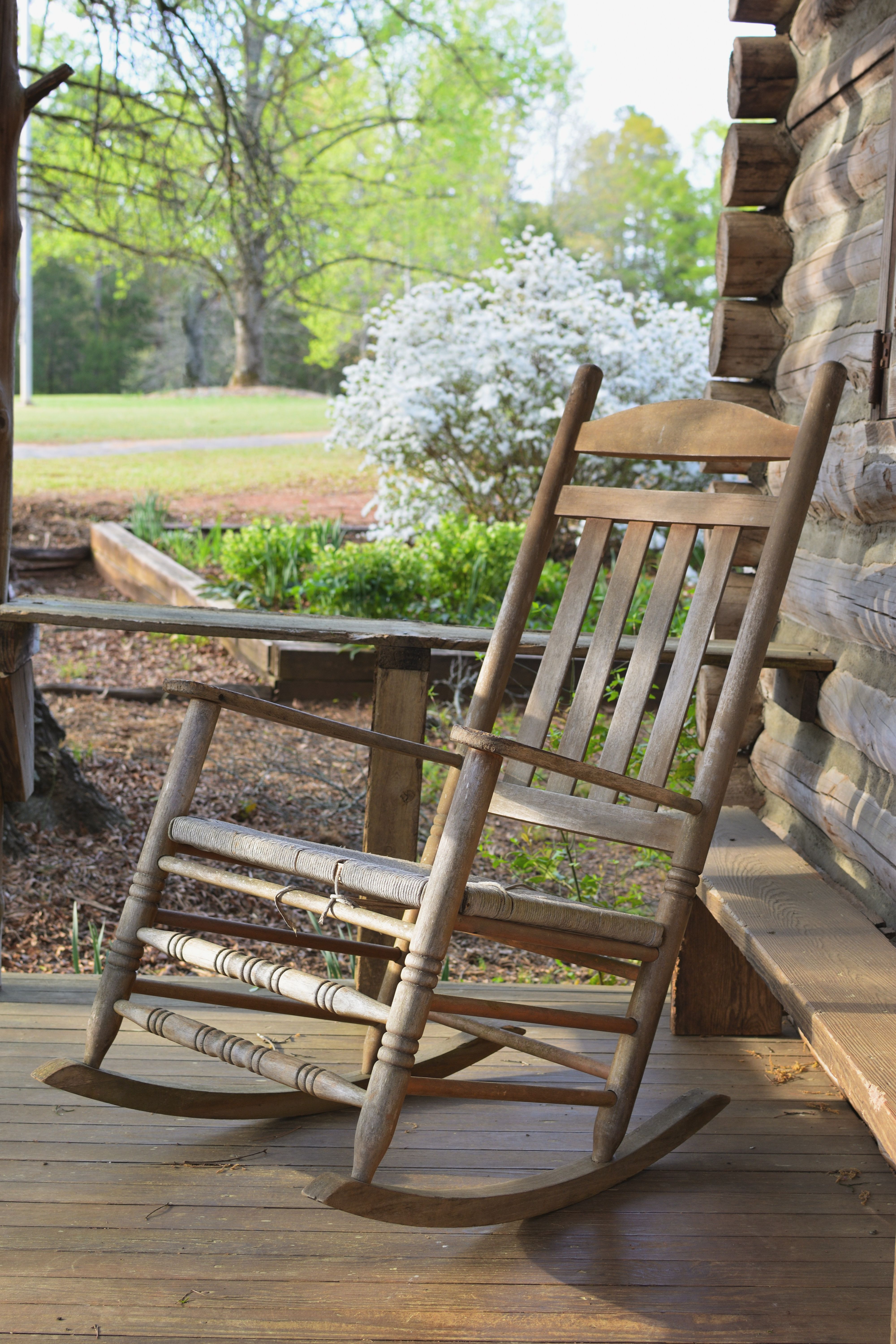 Rustic Rocking Chair on Southern Log Cabin Porch · Free Stock Photo