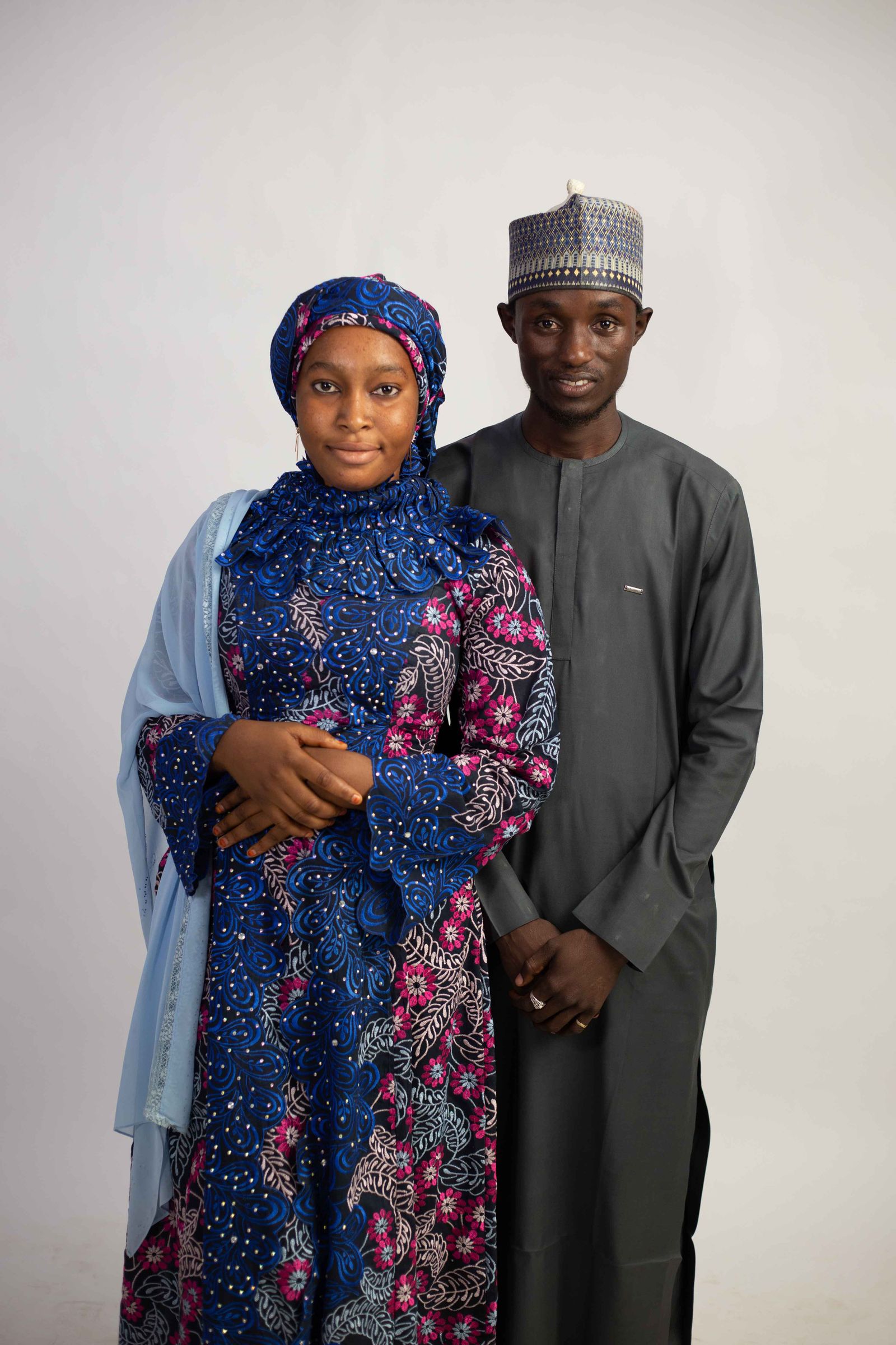 Graduation Portrait of Two Adults in Traditional Attire · Free Stock Photo