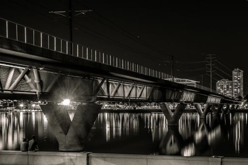 Free Black and white photo of a bridge at night in Tempe, Arizona with reflections. Stock Photo