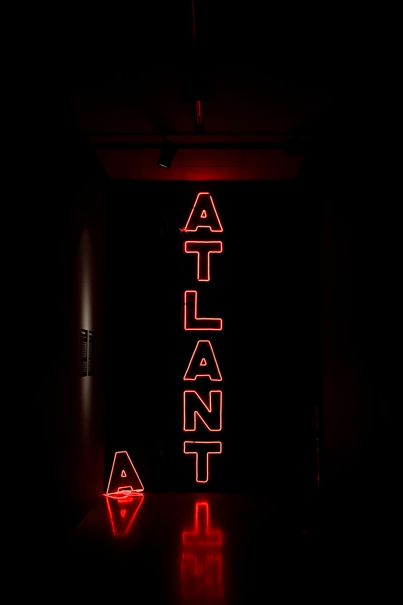 Neon Atlanta sign glowing in the dark
