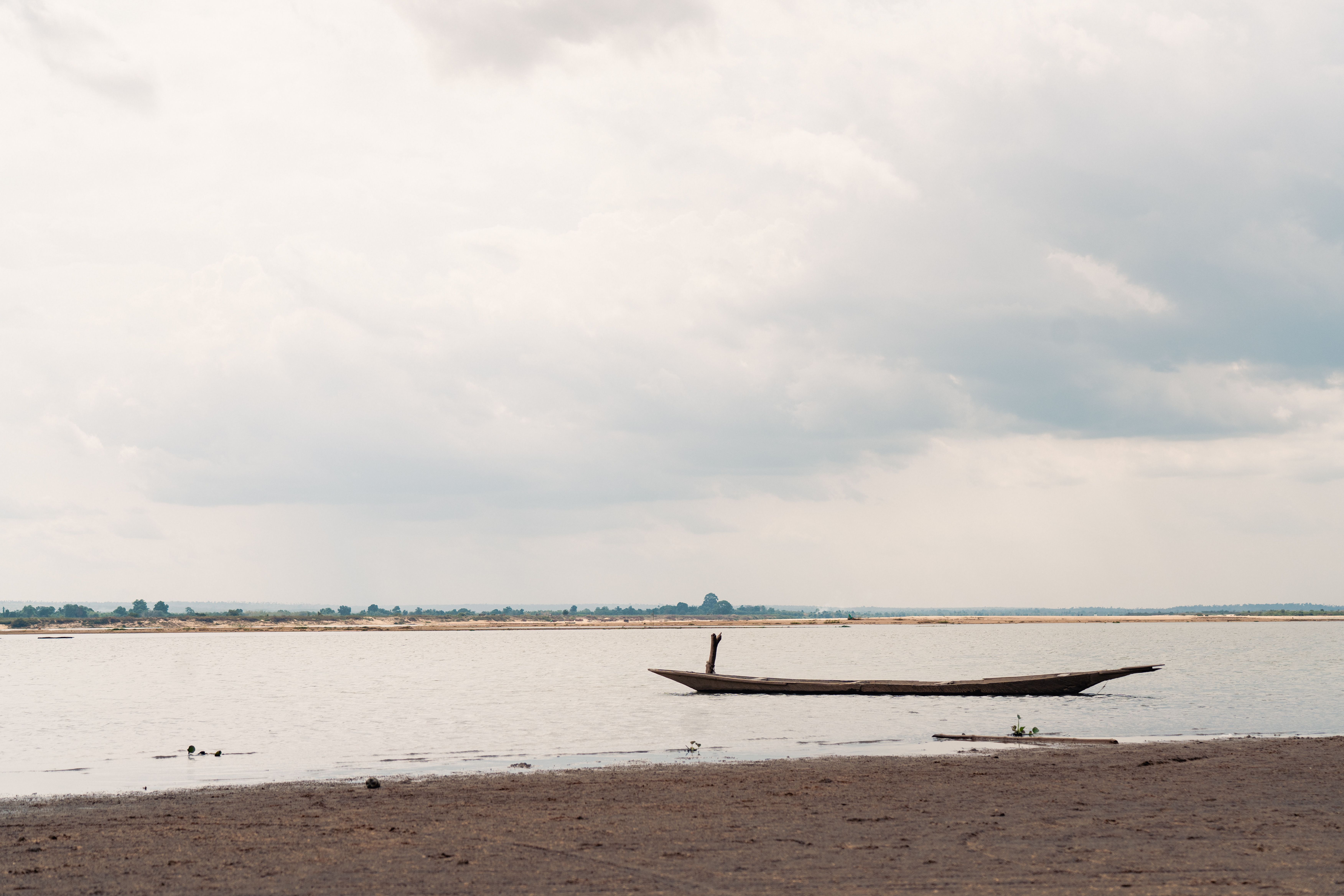 Serene landscape with traditional canoe on nigerian river, DR Congo