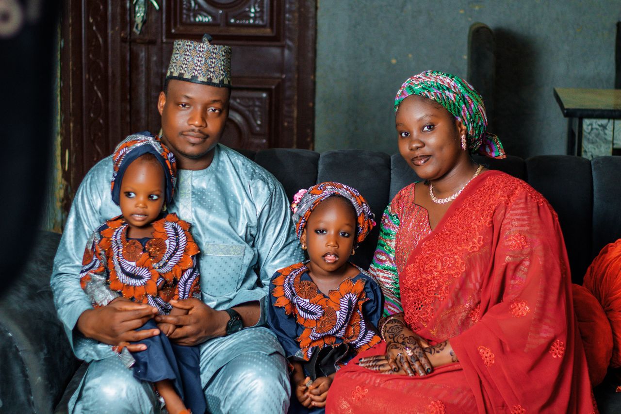 African family in traditional attire, representing the home Kenyans abroad are building in Kilifi