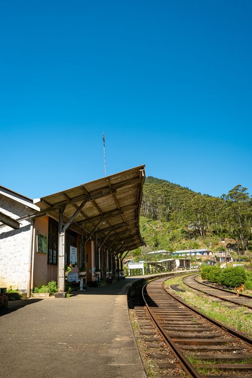 Free A beautiful railway station in Sri Lanka surrounded by lush greenery and blue skies. Stock Photo