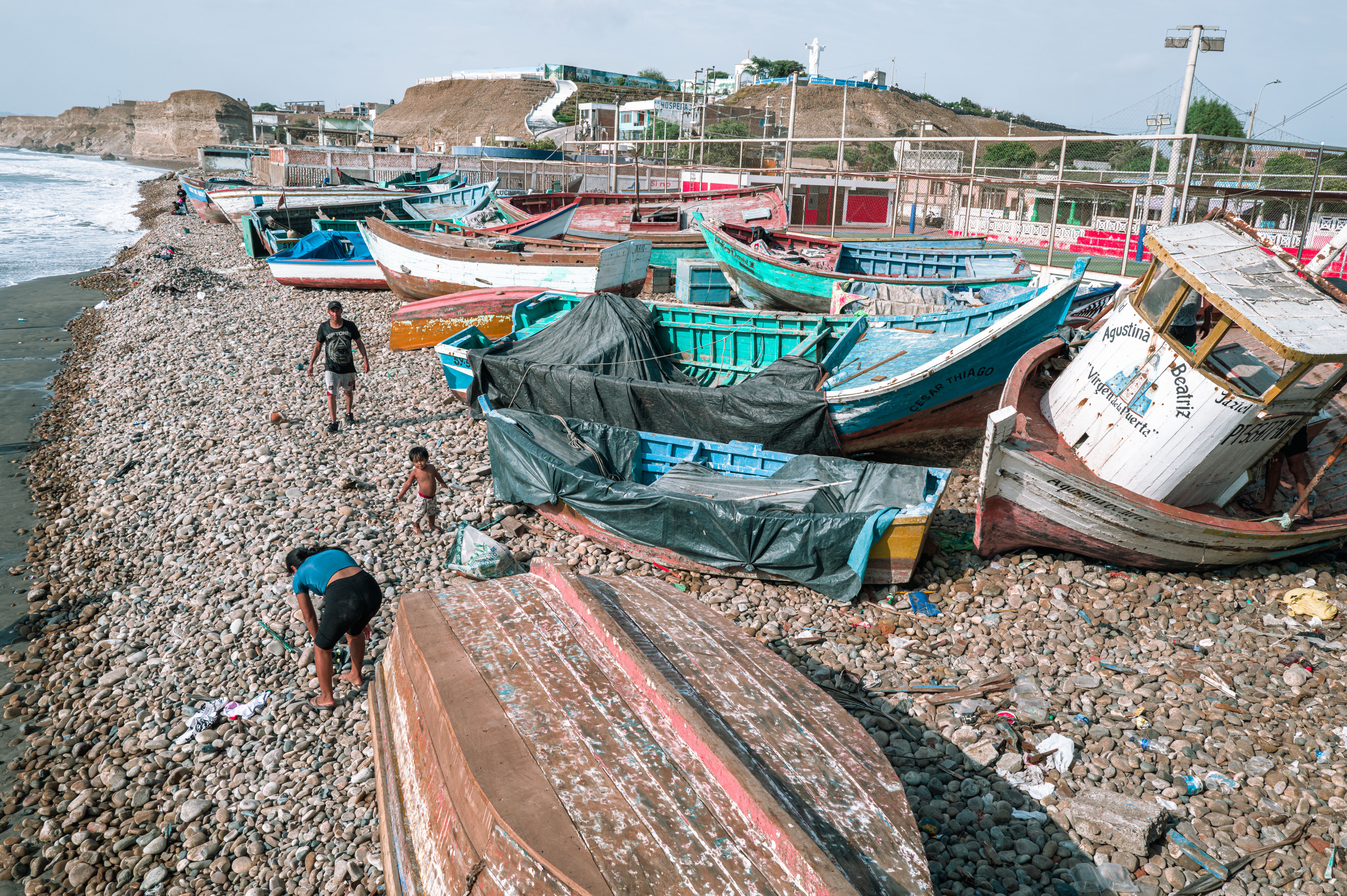 Colorful Fishing Boats on Pebble Beach in Pacasmayo · Free Stock Photo