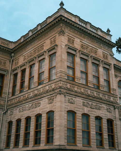 Free Ornate stone facade of a historic European building under a clear sky. Stock Photo