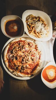 A delicious spread of pizza, pasta, and soup served in Budapest, Hungary.