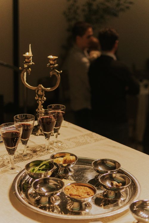 Free A sophisticated dining setup with candlelight and a variety of plated appetizers, exuding warmth and elegance. Stock Photo