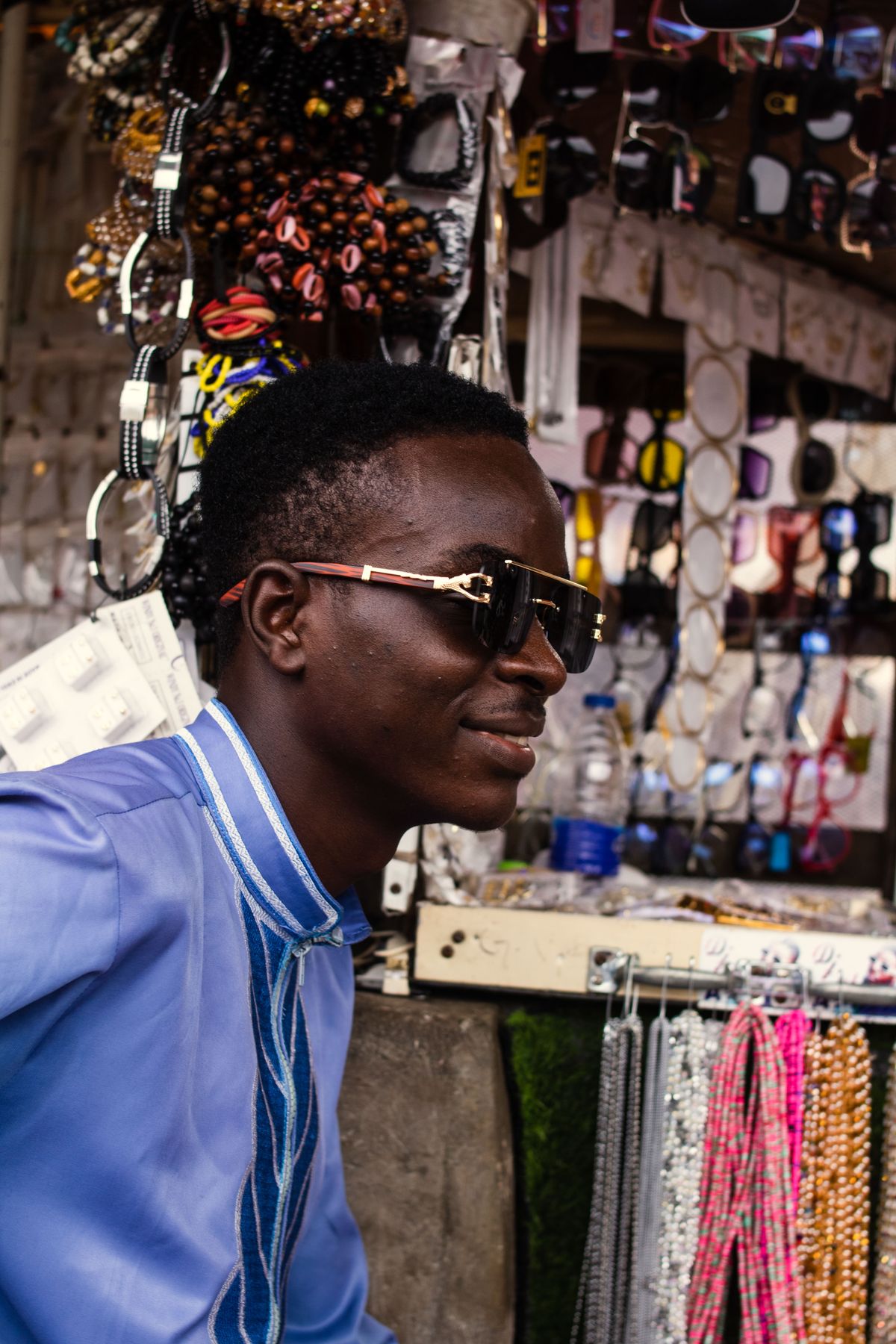 Nigerian fashion accessories seller in a market