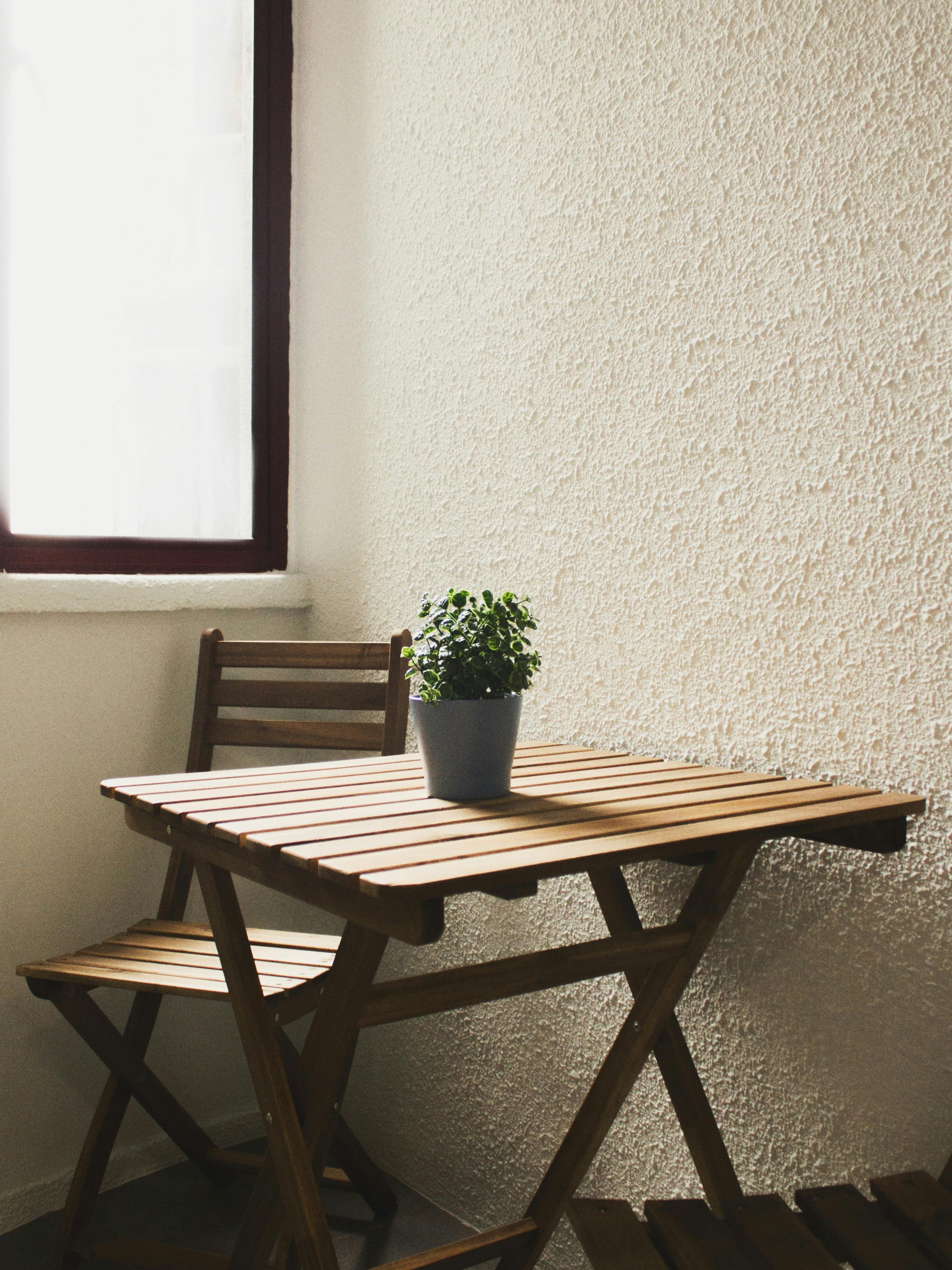 Empty chair facing window with natural light, symbolizing reflection, no face visible
