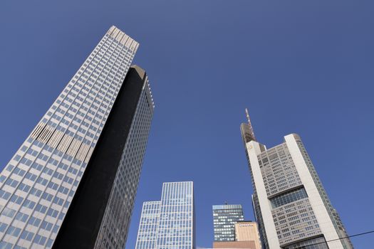 High-rise buildings of Frankfurt against a clear blue sky, showcasing modern architecture.