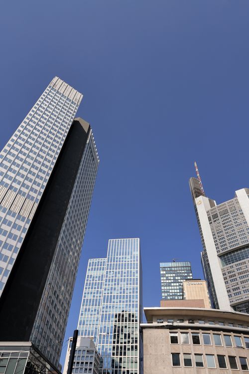 Free Stunning view of modern skyscrapers in Frankfurt under a clear blue sky, capturing the city's architectural elegance. Stock Photo