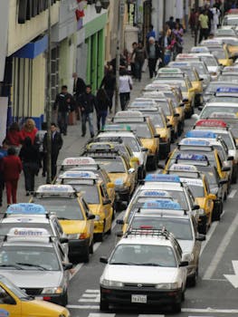 Discover the bustling city streets and traffic congestion of Trujillo, Peru, with rows of cabs and commuters.