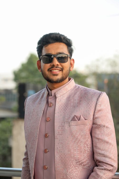Free A fashionable man poses outdoors in elegant traditional Indian attire during the day. Stock Photo