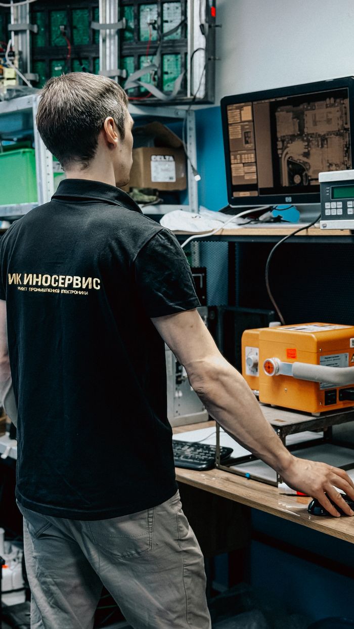 Technician analyzing computer hardware performance