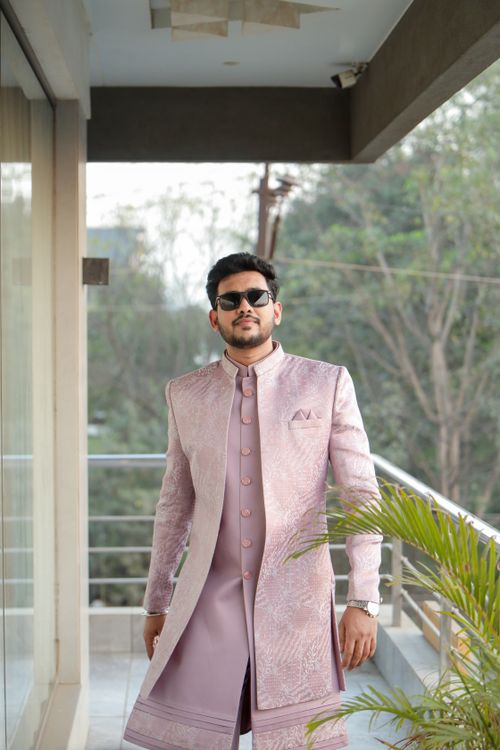 Free Stylish man in traditional Indian attire posing confidently outdoors. Stock Photo