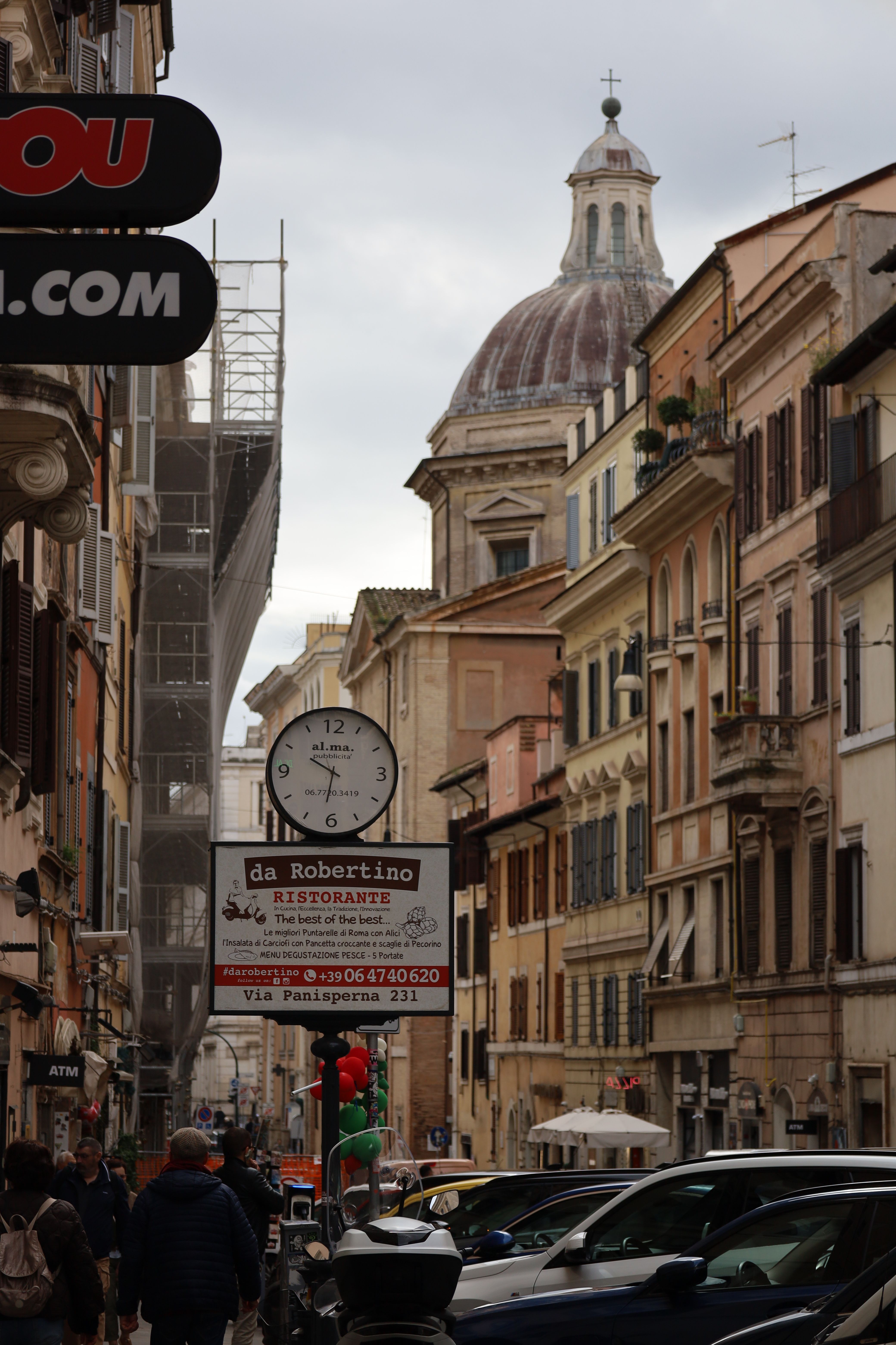 Vibrant Street Scene Leading to a Roman Dome · Free Stock Photo