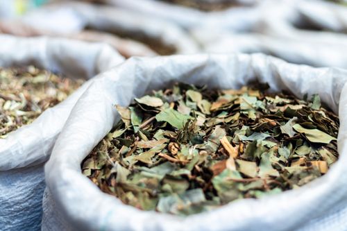 Free Close-up of dried herbal leaves in bags at a São Paulo market, showcasing natural textures. Stock Photo