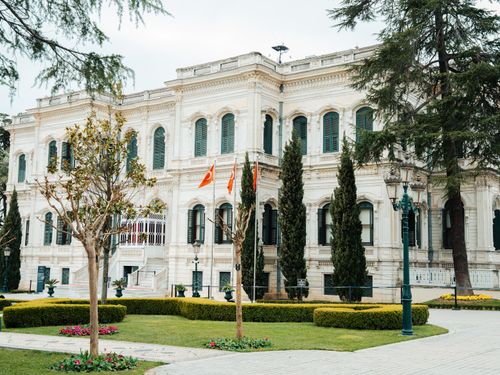 Free Elegant Ottoman-style building in Istanbul, rich in cultural heritage and surrounded by lush greenery. Stock Photo