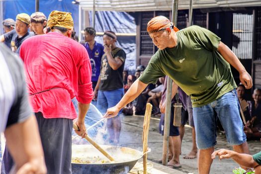 Traditional cooking event in Central Java, showcasing local culinary practices and community participation.