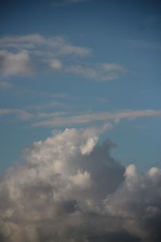 Majestic cloud formations set against a vivid blue sky, perfect for weather and nature themes.